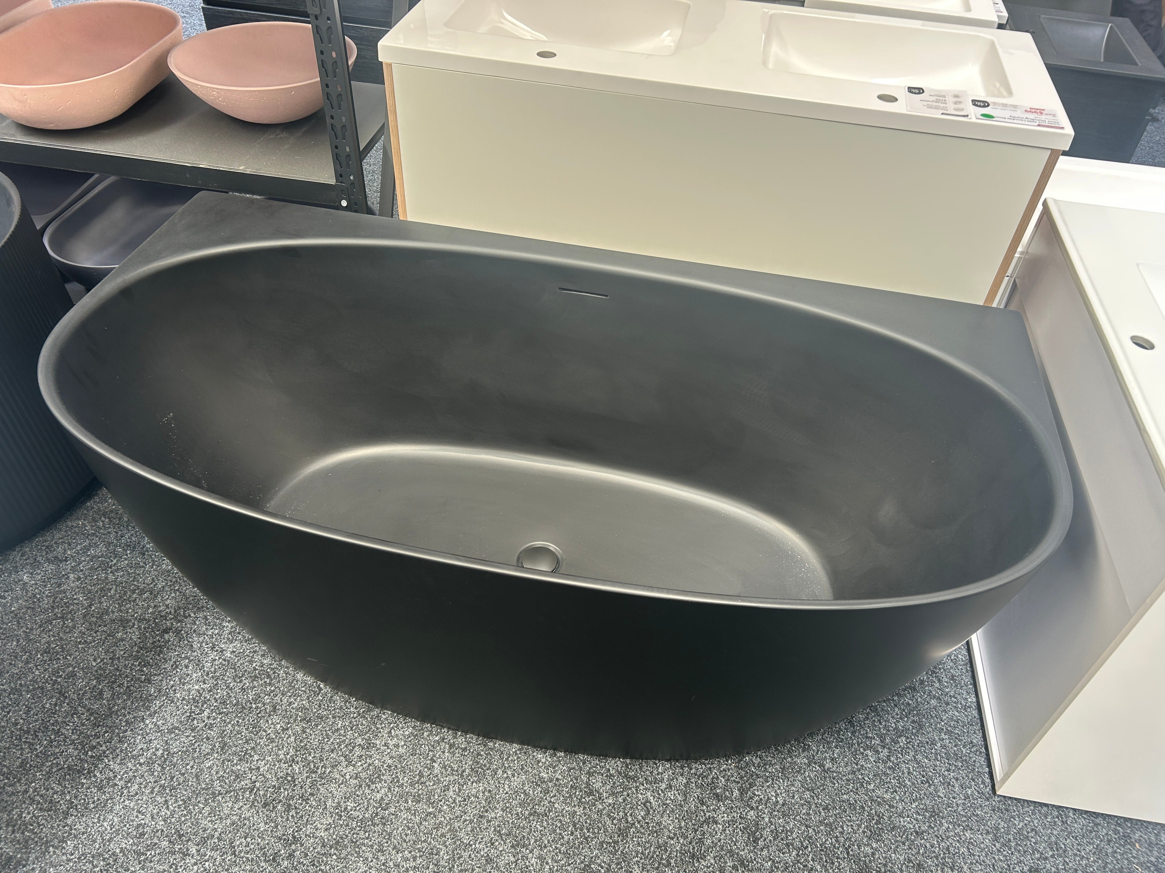 A matte black back-to-wall bath clearance new