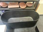 A large matte black freestanding bathtub or soaking tub with a ribbed exterior and smooth interior clearance sale