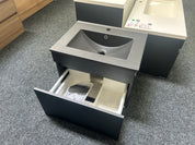A modern gray bathroom vanity with an integrated sink and an open drawer showing storage compartments,clearance sale deal 
