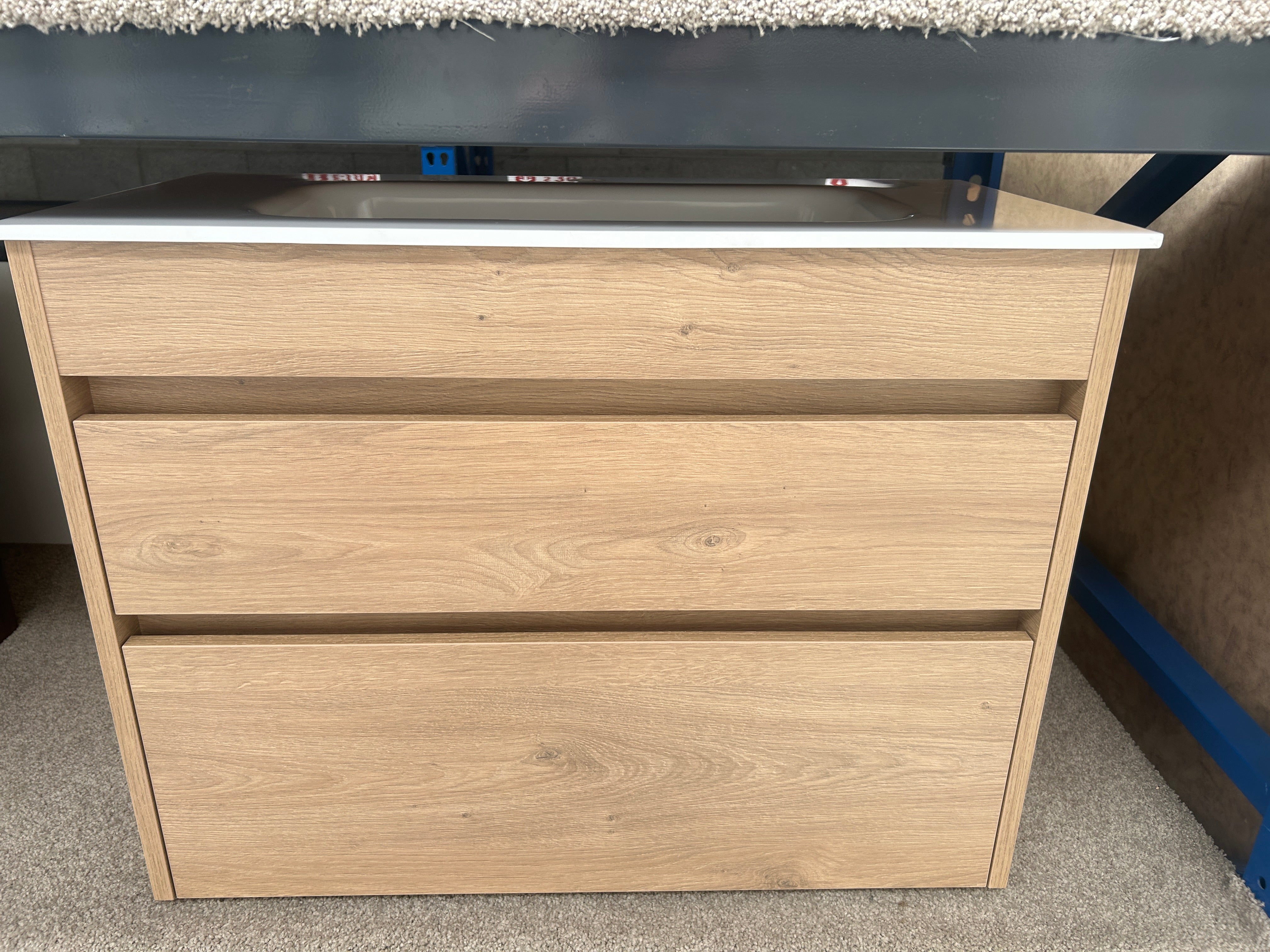 A light oak wood two-drawer vanity  with a white top surface, clearance deal sale