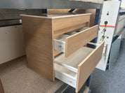 A wooden drawer cabinet with two pull-out drawers partially extended clearance deal sale