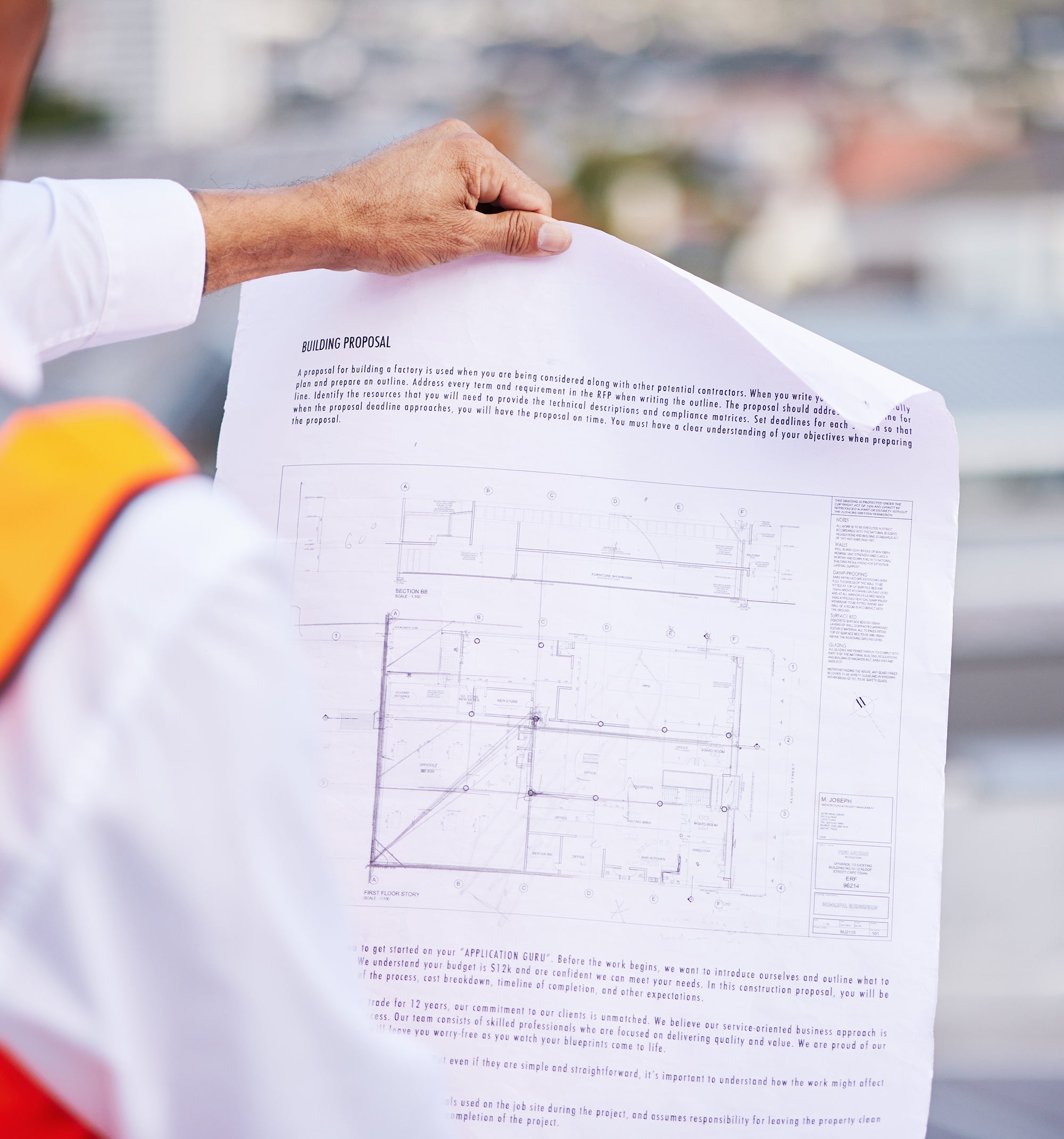 construction-site-blueprint-and-man-reading-docum-2025-04-06-07-11-58-utc.jpg