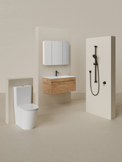 Modern bathroom with toilet, sink, and shower in a neutral setting